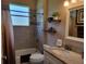 Updated bathroom with tub/shower combo and granite vanity at 370 Silver Maple Rd, Groveland, FL 34736