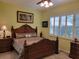 Large bedroom with a king-size bed, and ample natural light at 370 Silver Maple Rd, Groveland, FL 34736