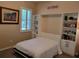 Guest bedroom with Murphy bed, built-in shelves, and window seat at 370 Silver Maple Rd, Groveland, FL 34736