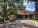 Community clubhouse with a circular driveway and landscaping at 370 Silver Maple Rd, Groveland, FL 34736