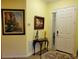 Bright entryway with artwork, console table, and view to interior at 370 Silver Maple Rd, Groveland, FL 34736