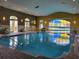 Indoor pool with a calming atmosphere and relaxing environment at 370 Silver Maple Rd, Groveland, FL 34736