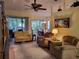 Comfortable living room with neutral color scheme and built-in shelving at 370 Silver Maple Rd, Groveland, FL 34736