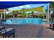 Resort-style pool with shade umbrellas and lounge chairs at 370 Silver Maple Rd, Groveland, FL 34736