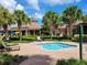 Relaxing spa tub with lounge chairs and resort clubhouse view at 370 Silver Maple Rd, Groveland, FL 34736