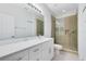 Modern bathroom with white cabinets and walk-in shower at 3721 Cleary Way, Orlando, FL 32828