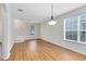 Light-filled dining area with hardwood floors and a ceiling fan at 3721 Cleary Way, Orlando, FL 32828