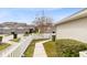 Landscaped side yard with walkway and white picket fence at 3721 Cleary Way, Orlando, FL 32828