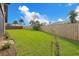 Large backyard, grassy lawn, wooden fence surrounds at 4 Sea Hawk Dr, Ormond Beach, FL 32176