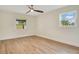 Simple bedroom with hardwood floors and a window with natural light at 4 Sea Hawk Dr, Ormond Beach, FL 32176