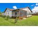 Back exterior view of house with screened porch at 4 Sea Hawk Dr, Ormond Beach, FL 32176