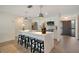 Modern kitchen featuring white cabinets, quartz countertops, and an island with seating at 4 Sea Hawk Dr, Ormond Beach, FL 32176