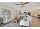 Bright living room with hardwood floors, neutral decor and a ceiling fan at 4 Sea Hawk Dr, Ormond Beach, FL 32176