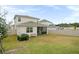 Home features a fenced-in backyard with screened patio at 4398 Davos Dr, Clermont, FL 34711