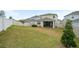 Spacious backyard with a large grassy area at 4398 Davos Dr, Clermont, FL 34711