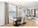 Dining area with dark wood table and neutral colored chairs at 4398 Davos Dr, Clermont, FL 34711