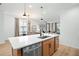 Kitchen island with white countertop and stainless steel dishwasher at 4398 Davos Dr, Clermont, FL 34711