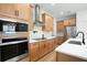 Modern kitchen with light wood cabinets and white countertops at 4398 Davos Dr, Clermont, FL 34711