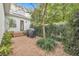 Brick paved patio with grill and lush landscaping at 4487 Twinview Ln, Orlando, FL 32814