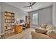 Home office with built-in bookshelves and comfortable seating at 4487 Twinview Ln, Orlando, FL 32814