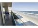 Balcony with ocean view and seating at 4575 S Atlantic Ave # 6703, Port Orange, FL 32127