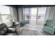 Living room with ocean view and balcony access at 4575 S Atlantic Ave # 6703, Port Orange, FL 32127