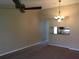 Living room with carpet, neutral walls and ceiling fan at 4709 Capri Pl # 189, Orlando, FL 32811