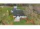 Aerial view of a renovated home with a newly landscaped yard at 4940 Spring Run Ave, Orlando, FL 32819