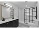 Modern bathroom with double vanity, marble shower, and black fixtures at 4940 Spring Run Ave, Orlando, FL 32819