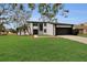 Stylish two-story home with a manicured lawn and attached garage at 4940 Spring Run Ave, Orlando, FL 32819