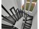 Modern staircase with black metal railings and wood steps at 4940 Spring Run Ave, Orlando, FL 32819