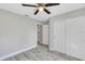 Spacious bedroom with double sliding doors and ceiling fan at 5 Emerald Trl, Ocala, FL 34472