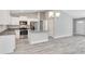 Modern kitchen with island, stainless steel appliances, and granite countertops at 5 Emerald Trail Pl, Ocala, FL 34472