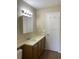 Bathroom boasts a vanity, medicine cabinet, and toilet at 5275 Images Cir # 306, Kissimmee, FL 34746