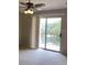 Bedroom with sliding glass doors to a balcony at 5275 Images Cir # 306, Kissimmee, FL 34746