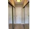 Hallway with mirrored closet doors and access to rooms at 5275 Images Cir # 306, Kissimmee, FL 34746