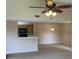 Living room with high ceiling and ceiling fan at 5275 Images Cir # 306, Kissimmee, FL 34746