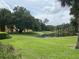 Peaceful pond view with lush green landscaping at 5275 Images Cir # 306, Kissimmee, FL 34746