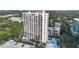 Aerial view of a high rise building, pool, and parking lot at 530 E Central Blvd # 603, Orlando, FL 32801