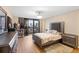 Bedroom with plush bed and city views at 530 E Central Blvd # 603, Orlando, FL 32801