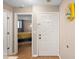 Inviting entryway with a white door leads to a bedroom with bright yellow accents at 530 E Central Blvd # 603, Orlando, FL 32801