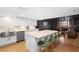 Stylish kitchen open to the living area, boasting a marble island with seating and sleek white cabinetry at 530 E Central Blvd # 603, Orlando, FL 32801