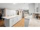 Expansive kitchen with an island, marble countertops, stainless steel appliances, and abundant cabinet space at 530 E Central Blvd # 603, Orlando, FL 32801