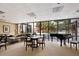 Comfortable living room features a grand piano and large windows with garden views at 530 E Central Blvd # 603, Orlando, FL 32801
