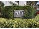 Elegant building signage displayed amongst lush manicured greenery at 530 E Central Blvd # 603, Orlando, FL 32801