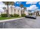 Condo building with palm trees and parking lot at 532 Orange Dr # 23, Altamonte Springs, FL 32701