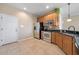 Kitchen with stainless steel appliances and light wood cabinets at 5441 Leighton Ln, Oviedo, FL 32765