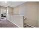 Upstairs hallway with carpeted floor and access to bedrooms at 5441 Leighton Ln, Oviedo, FL 32765