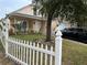 House exterior with picket fence and landscaping at 5453 Wood Crossing St, Orlando, FL 32811