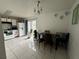 Kitchen with dining area and white cabinets at 5453 Wood Crossing St, Orlando, FL 32811